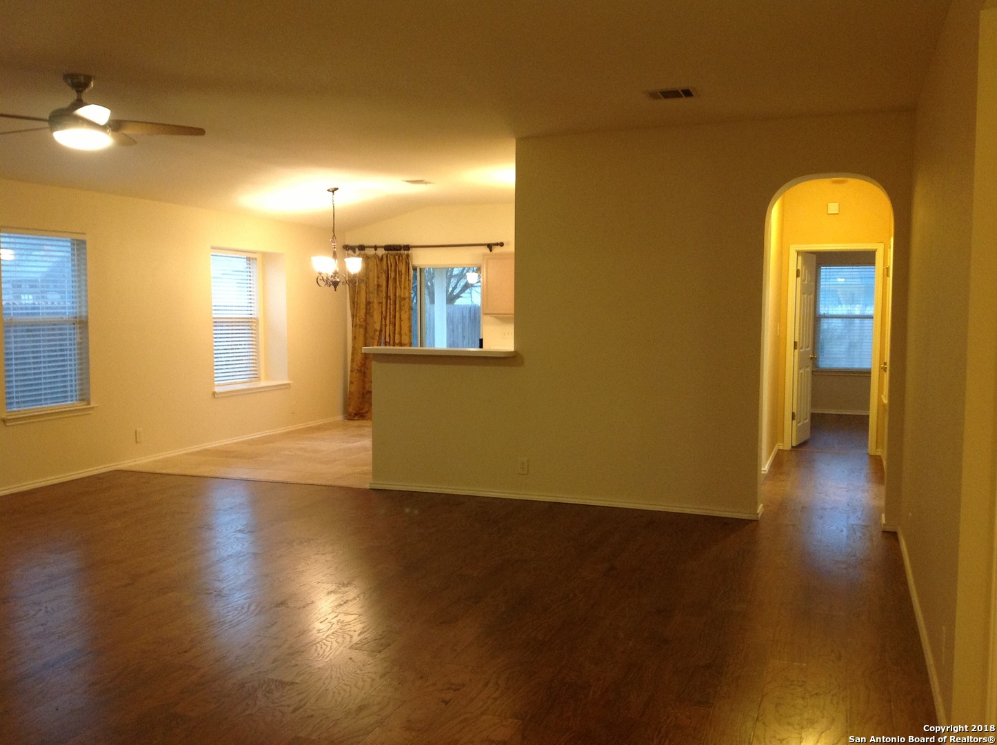 9030 Pinseeker Selma, TX 78154 - Photo 3 of 16 a view of empty room with wooden floor and fan