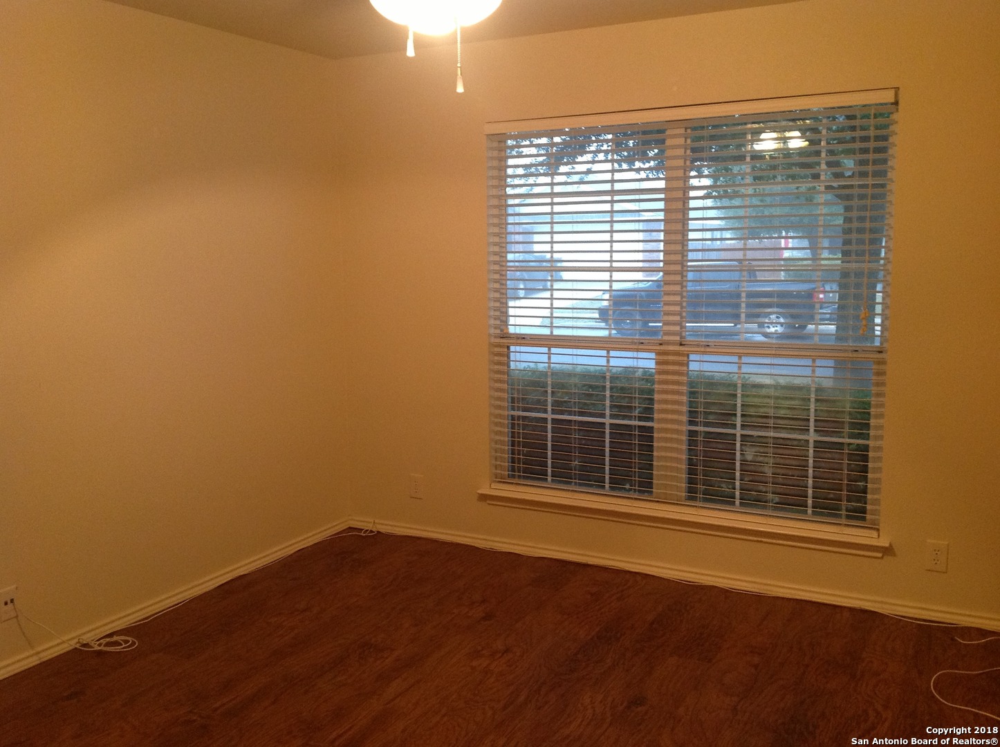 9030 Pinseeker Selma, TX 78154 - Photo 9 of 16 a view of empty room with wooden floor and fan