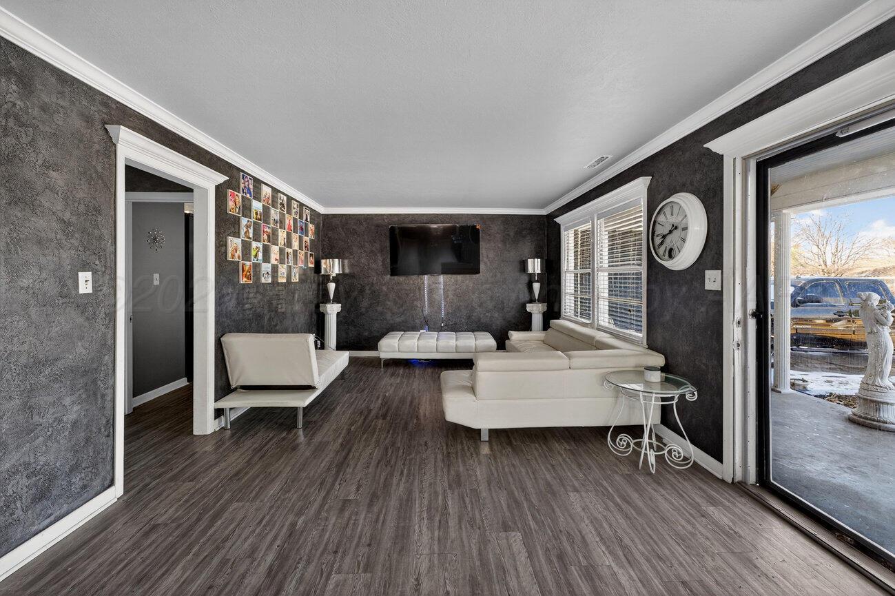 3508 Concord Road Amarillo, TX 79109 - Photo 3 of 12 a living room with furniture and a wooden floor