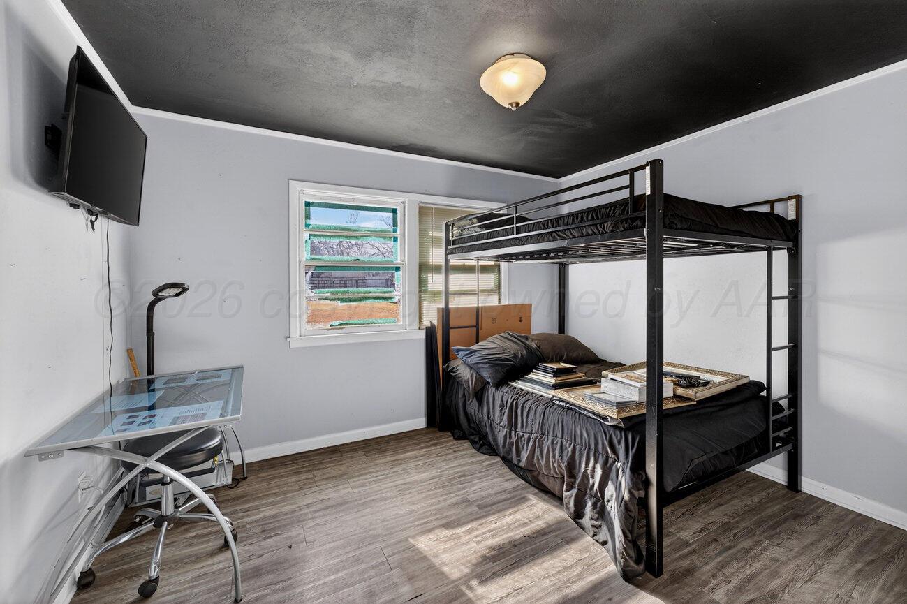 3508 Concord Road Amarillo, TX 79109 - Photo 8 of 12 a bedroom with furniture and a window