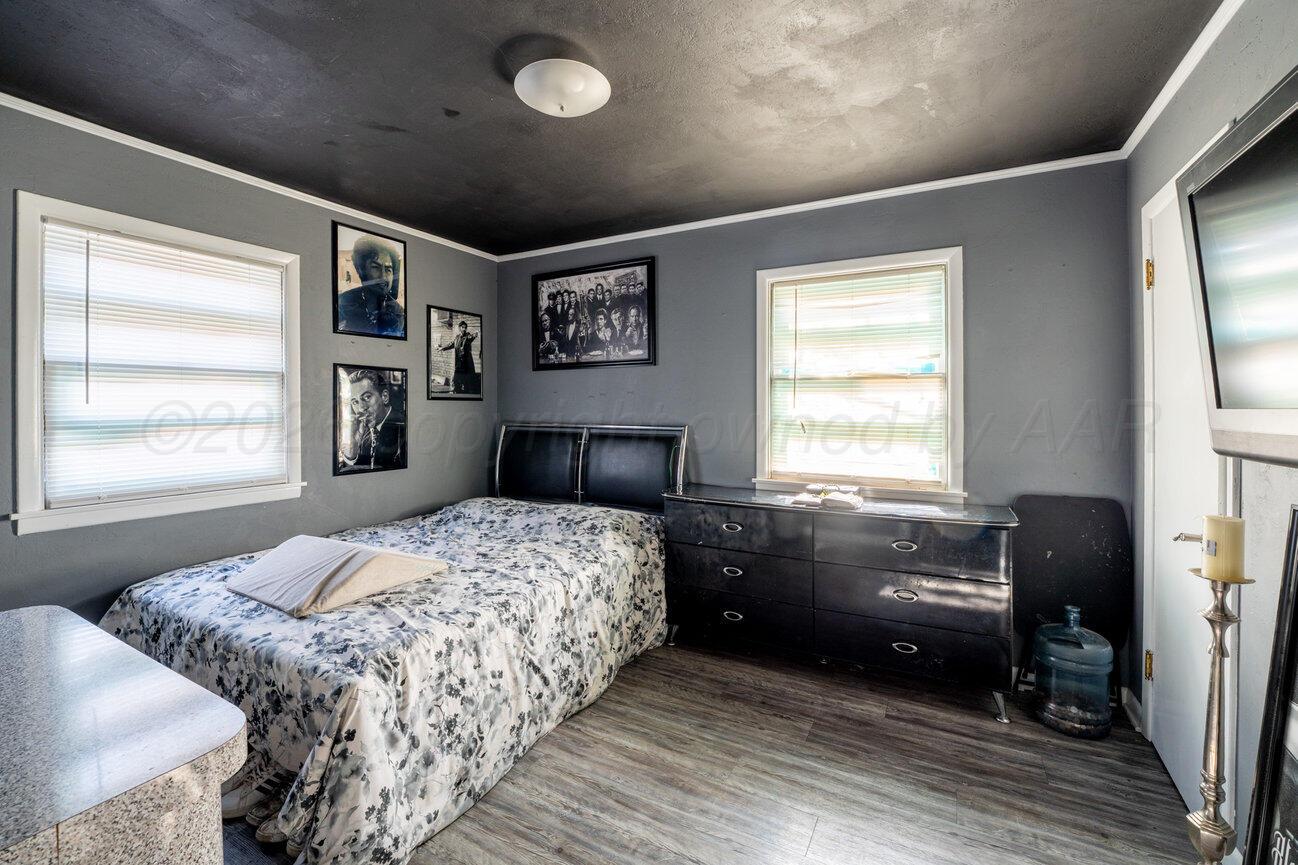 3508 Concord Road Amarillo, TX 79109 - Photo 10 of 12 a bedroom with a bed and a large window