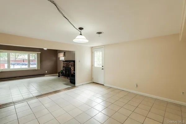 a view of an empty room and window