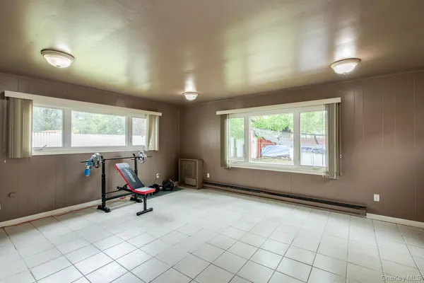 a view of an empty room with a fireplace