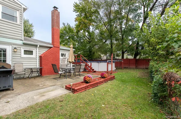 a backyard of a house with seating space