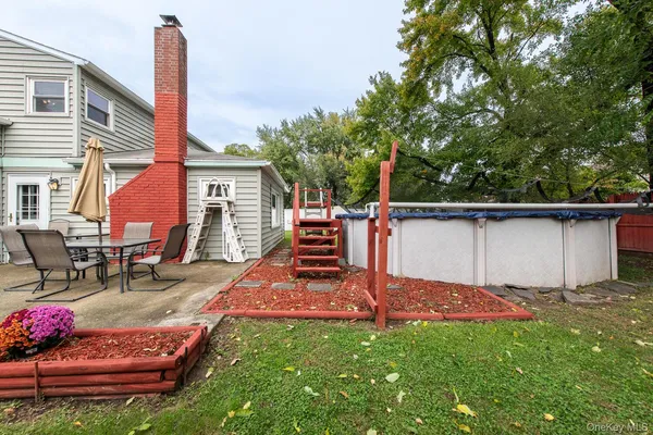 a backyard of a house with seating space