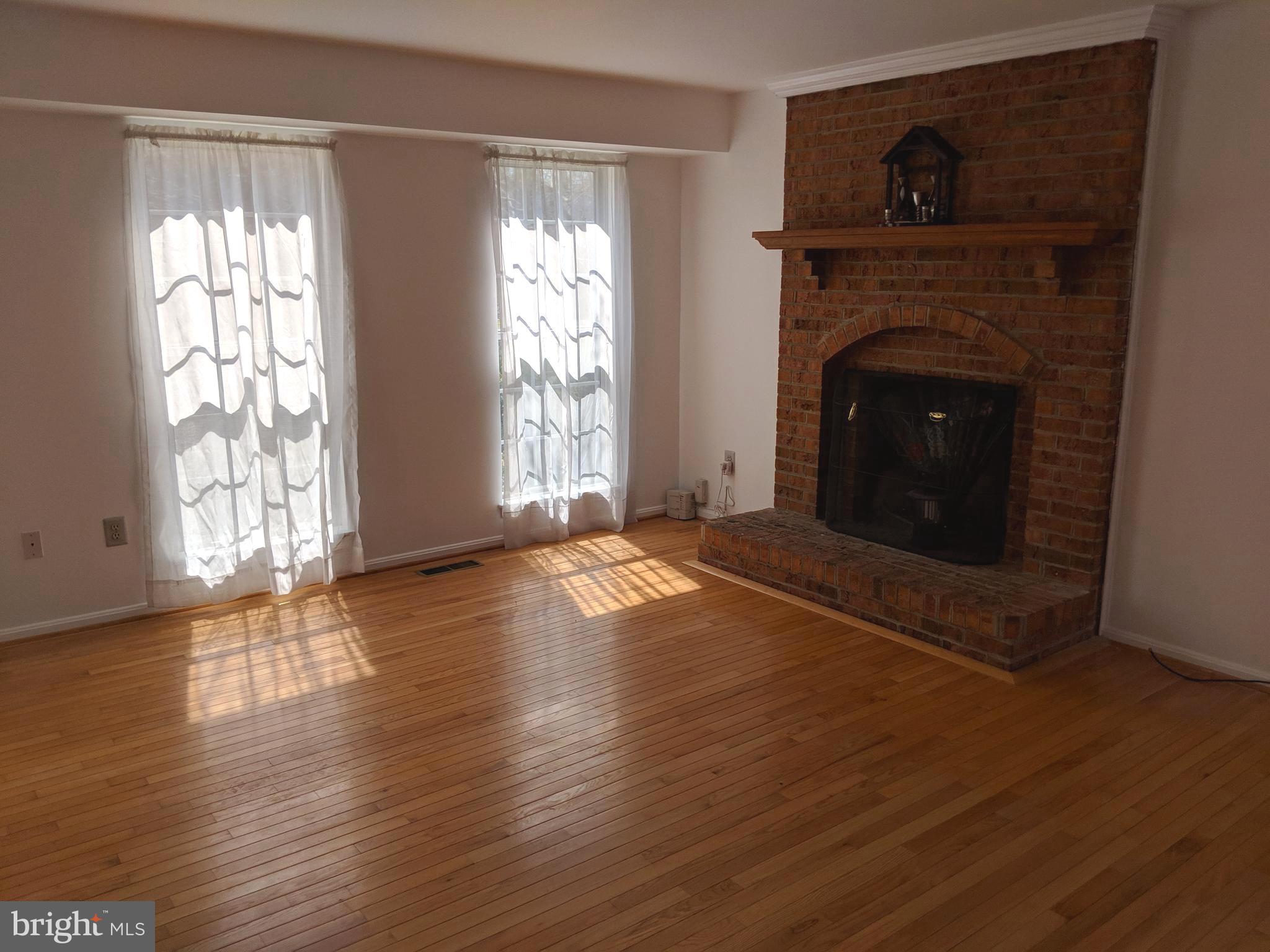 909 Pointer Ridge Drive Gaithersburg, MD 20878 - Photo 5 of 17 Living room with fireplace