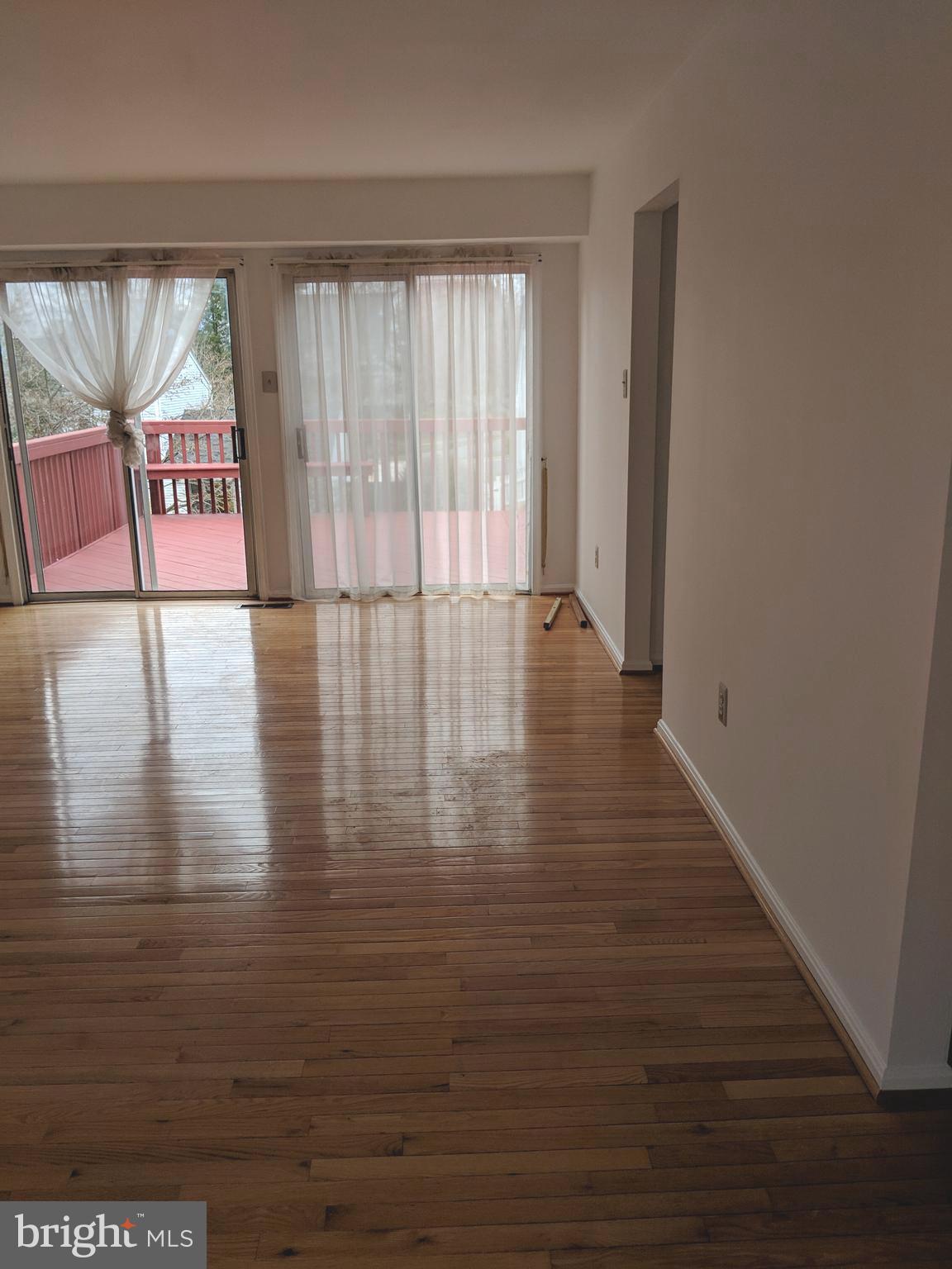 909 Pointer Ridge Drive Gaithersburg, MD 20878 - Photo 7 of 17 Living room with sliding doors out to deck