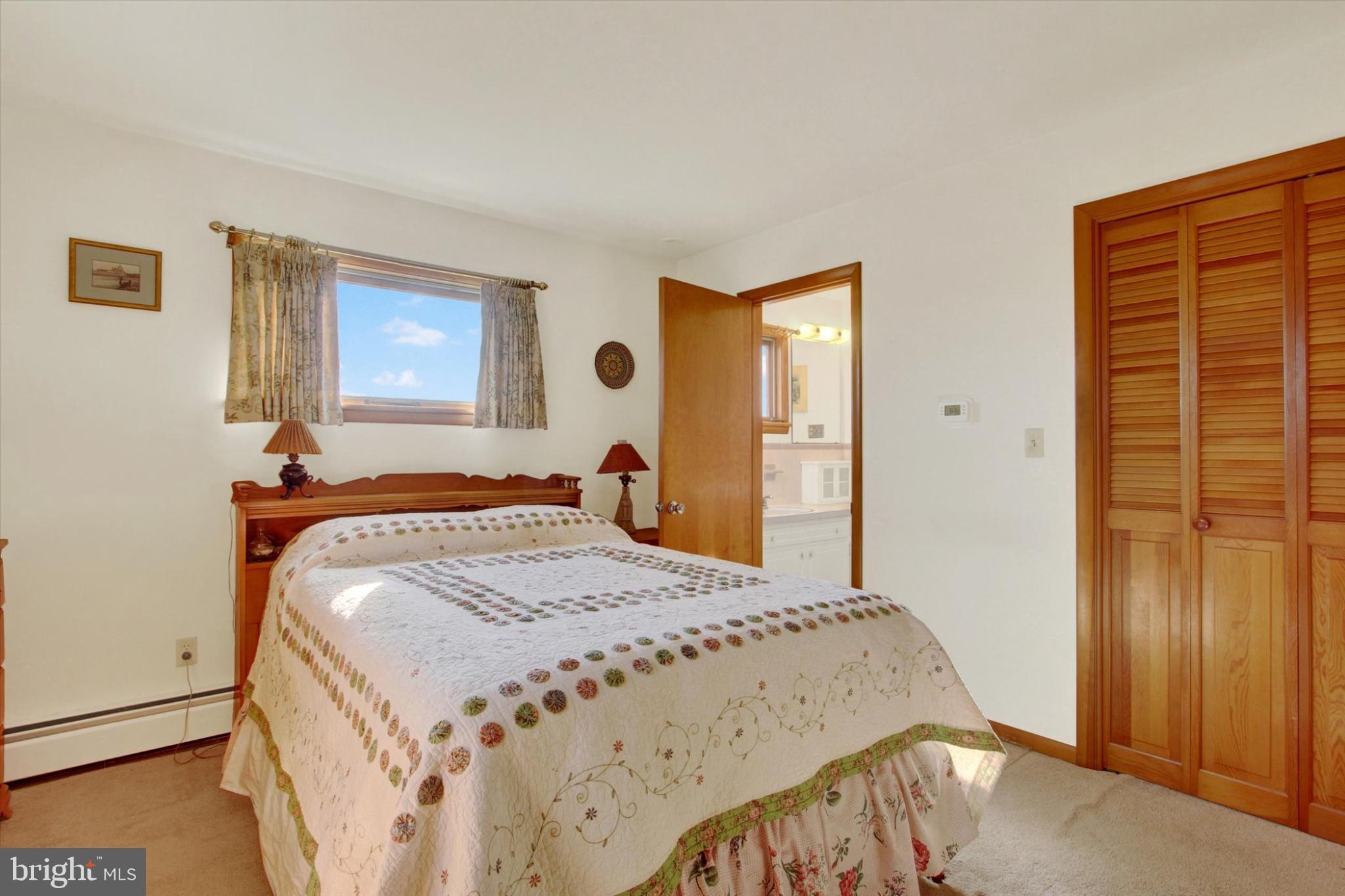 930 Hoffman Road Gettysburg, PA 17325 - Photo 12 of 36 a bedroom with a bed and a dresser