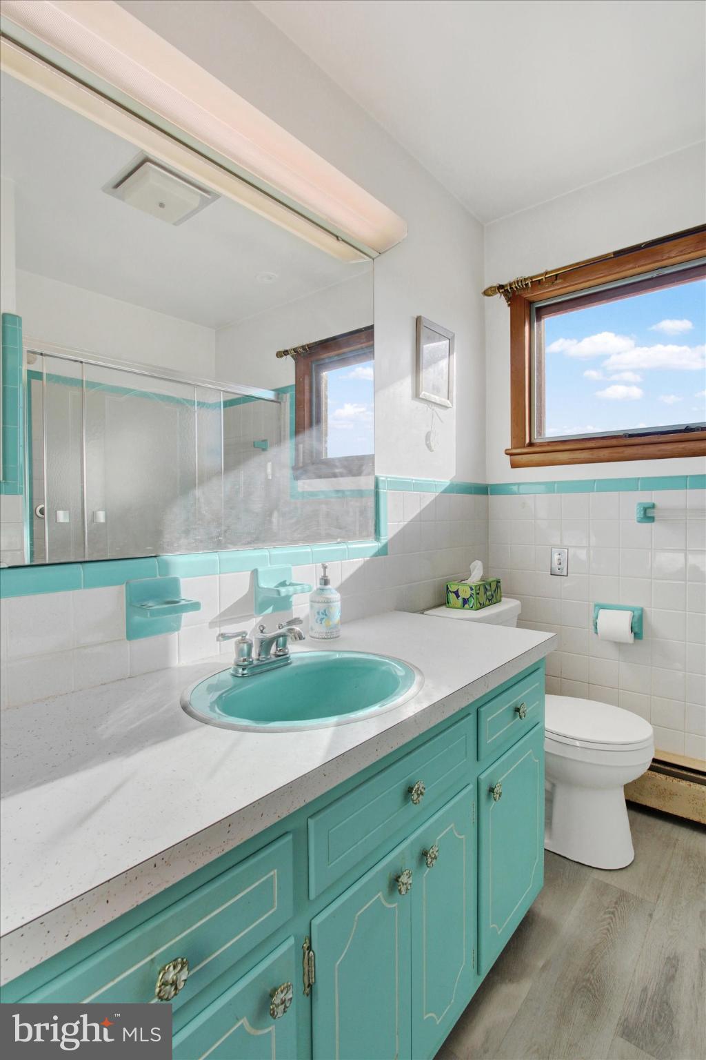 930 Hoffman Road Gettysburg, PA 17325 - Photo 15 of 36 a bathroom with a granite countertop sink mirror and toilet