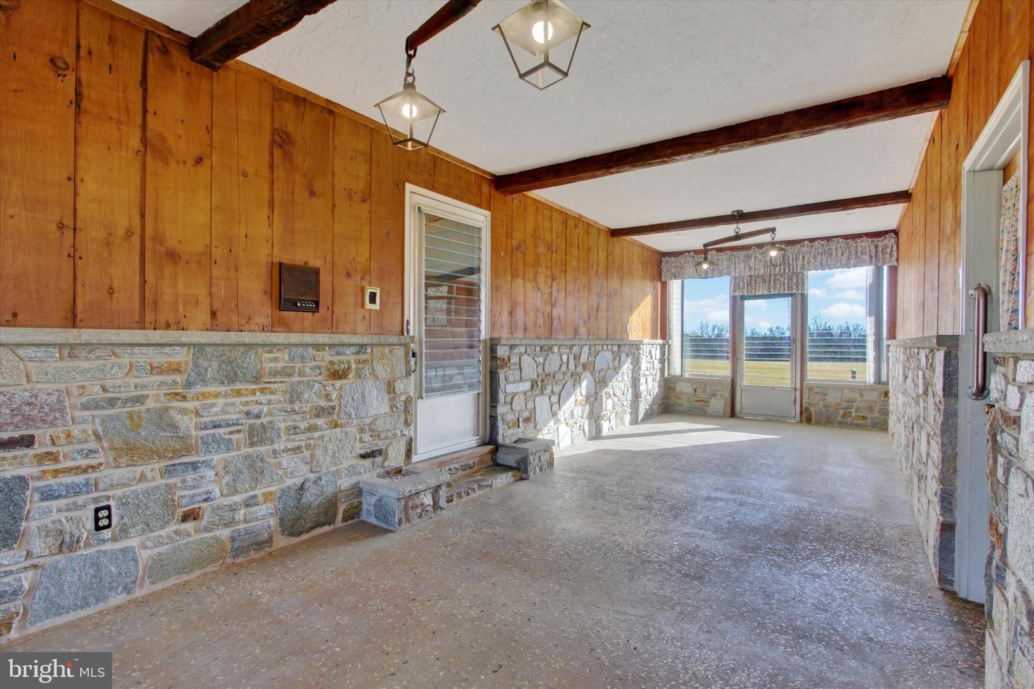 930 Hoffman Road Gettysburg, PA 17325 - Photo 17 of 36 a view of an empty room with a fireplace