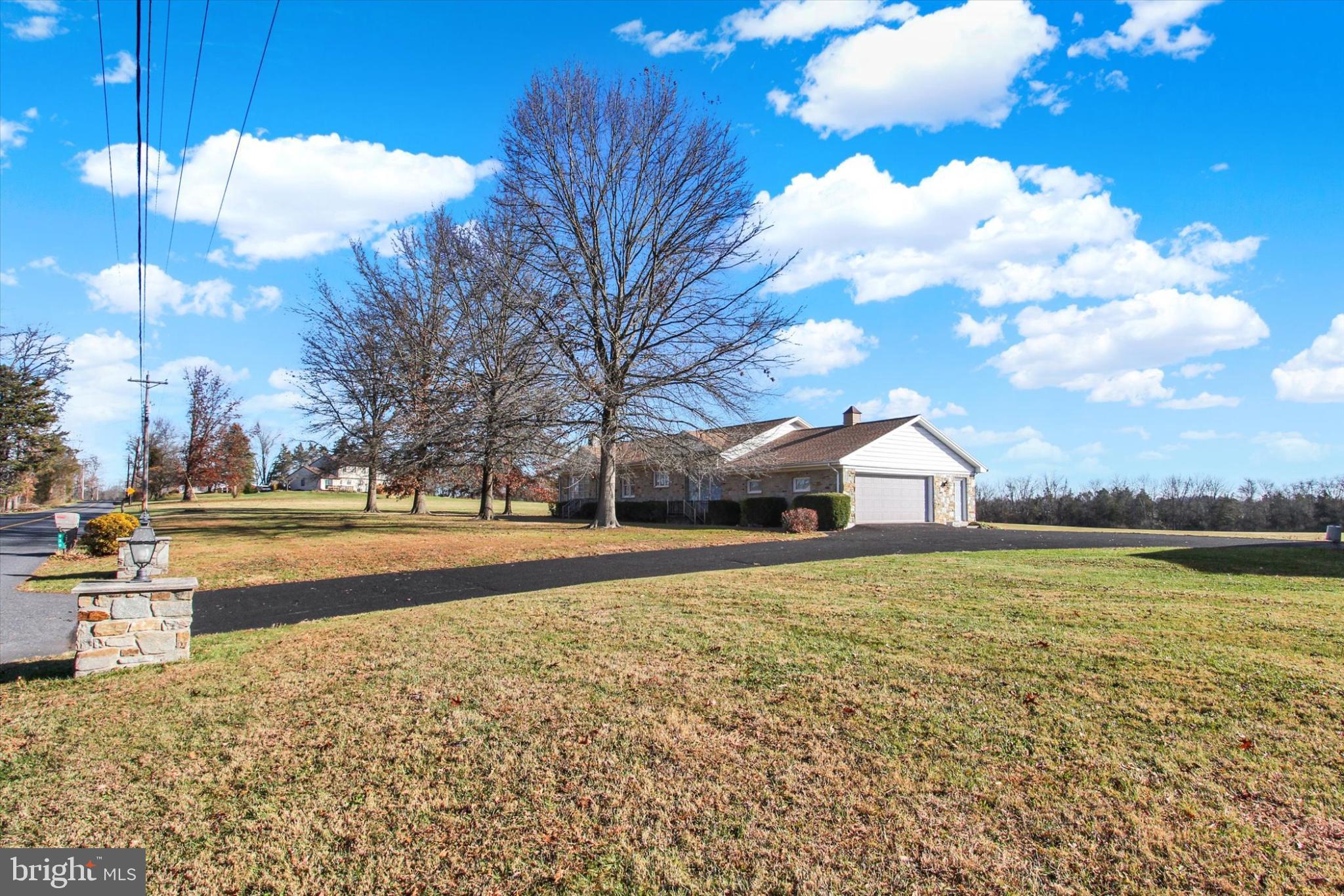 930 Hoffman Road Gettysburg, PA 17325 - Photo 35 of 36 a view of a house with a yard and a large tree