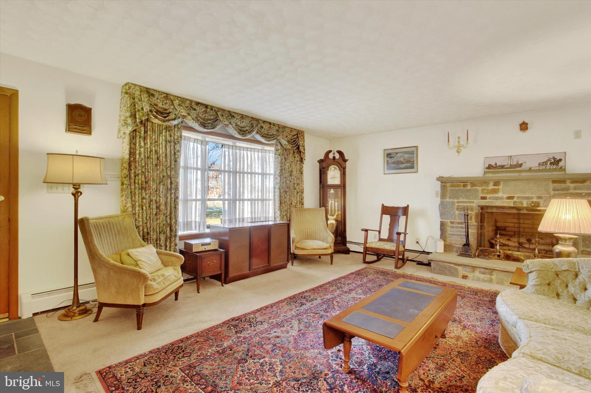 930 Hoffman Road Gettysburg, PA 17325 - Photo 5 of 36 a living room with furniture and a fireplace