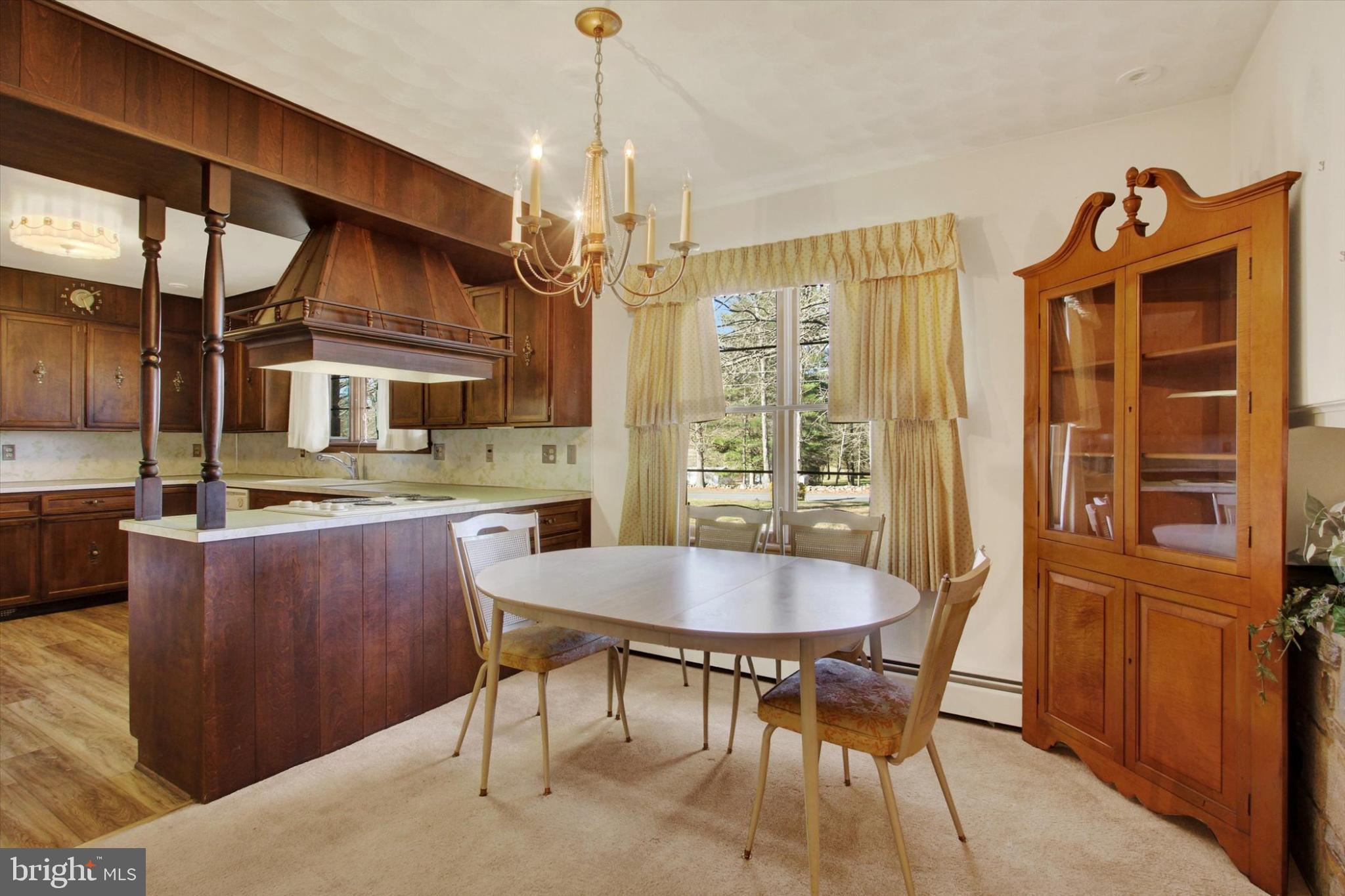 930 Hoffman Road Gettysburg, PA 17325 - Photo 7 of 36 a dining room with a wooden table and chairs