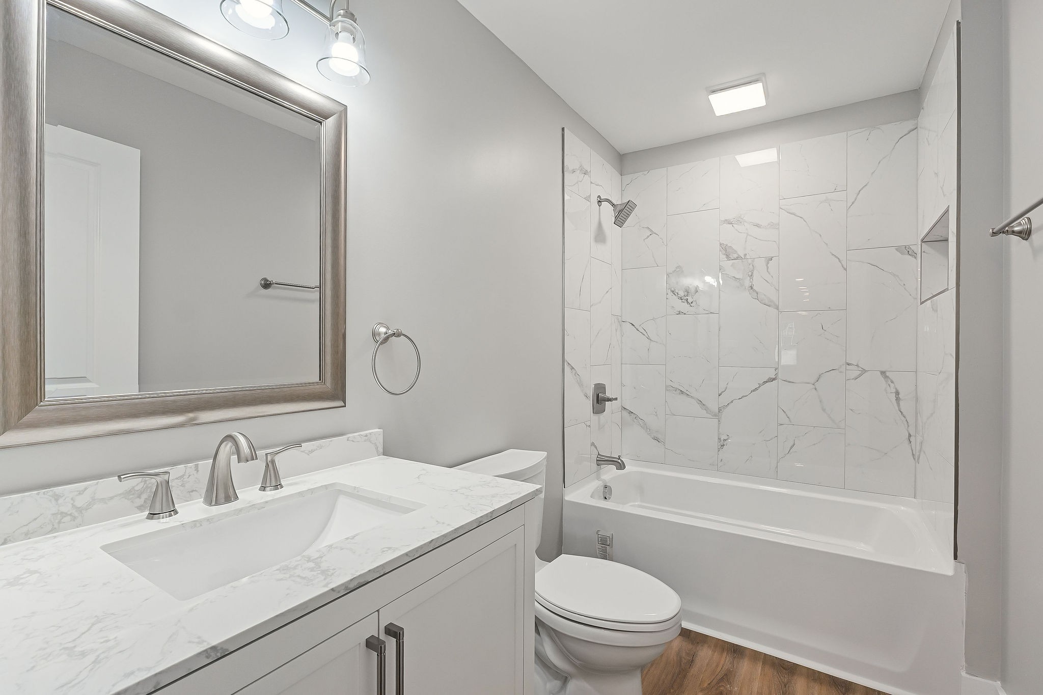 1053 Benton Tidwell Road Hilham, TN 38568 - Photo 13 of 27 a bathroom with a granite countertop sink a toilet and shower