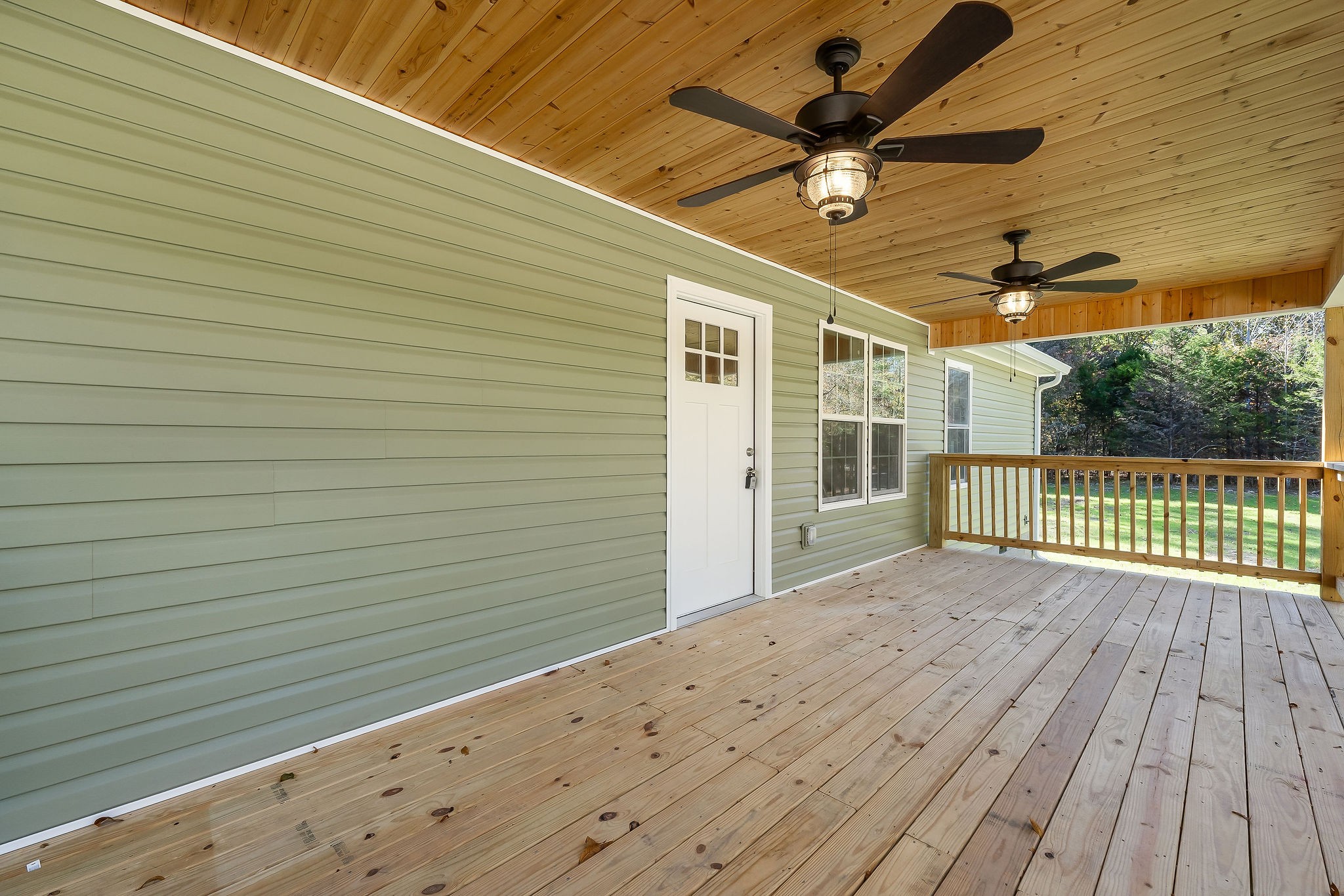 1053 Benton Tidwell Road Hilham, TN 38568 - Photo 25 of 27 a view of a balcony with a ceiling fan