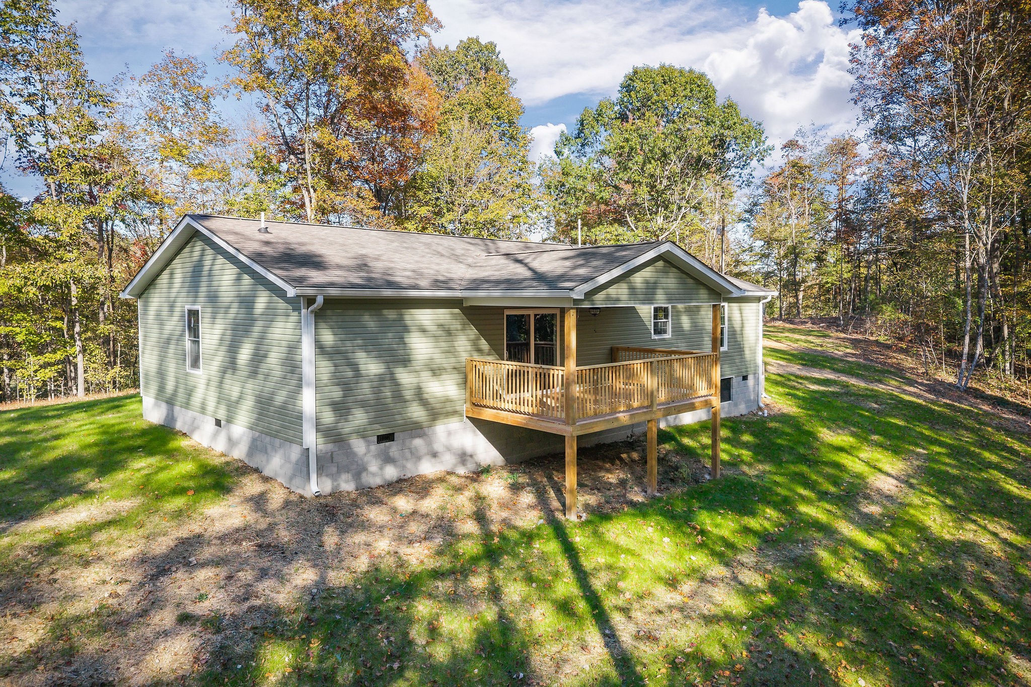 1053 Benton Tidwell Road Hilham, TN 38568 - Photo 26 of 27 a aerial view of a house with a yard table and chairs