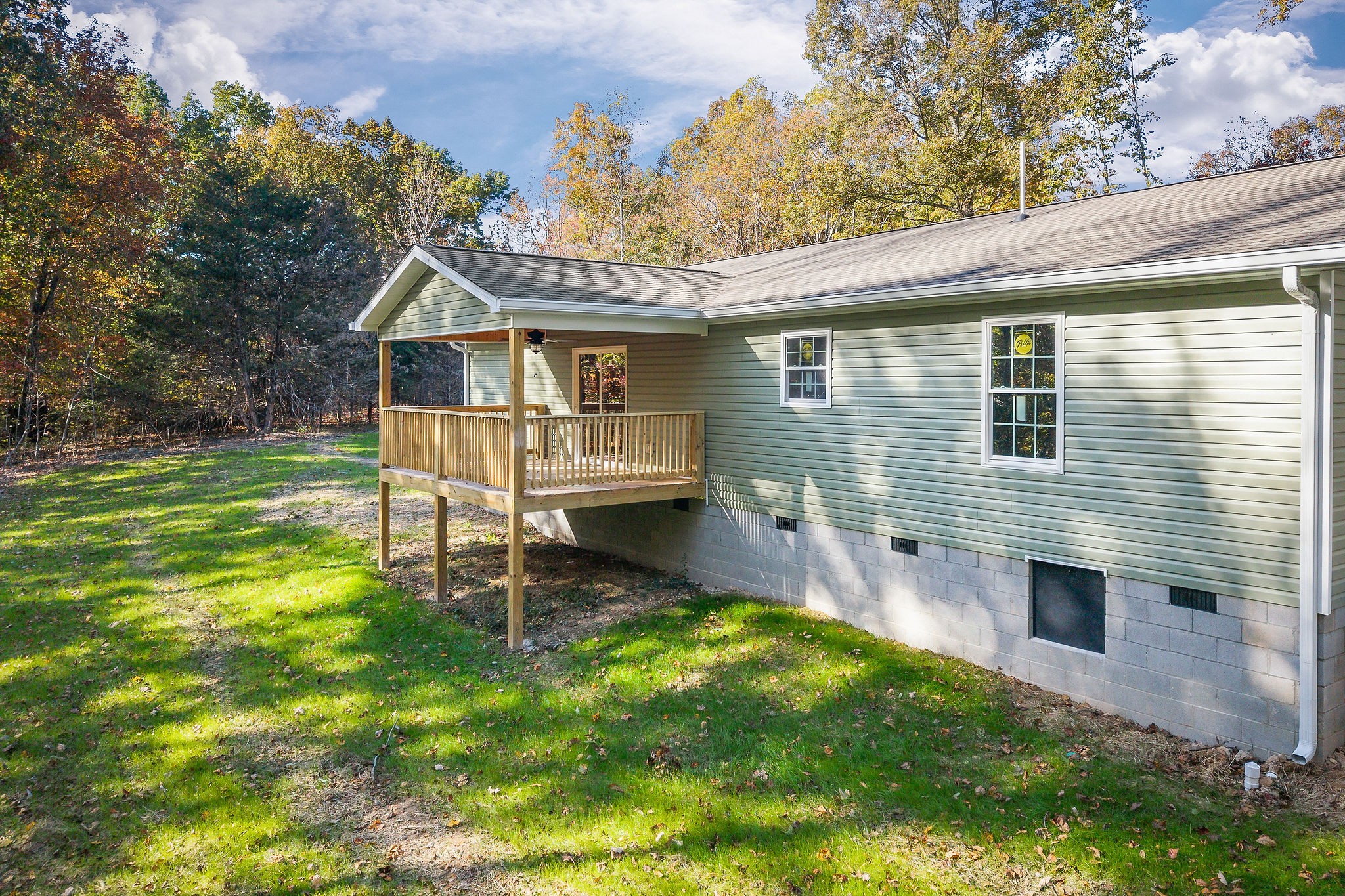 1053 Benton Tidwell Road Hilham, TN 38568 - Photo 27 of 27 a front view of a house with a yard table and chairs