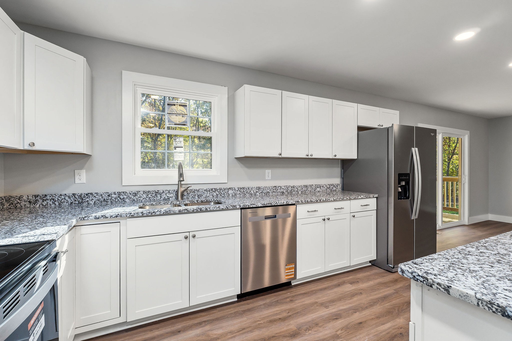 1053 Benton Tidwell Road Hilham, TN 38568 - Photo 7 of 27 a kitchen with granite countertop cabinets appliances and a counter space