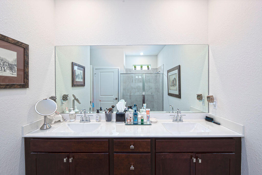 4480 Northwest Oakleaf Court Jensen Beach, FL 34957 - Photo 25 of 63 a bathroom with a sink and a mirror