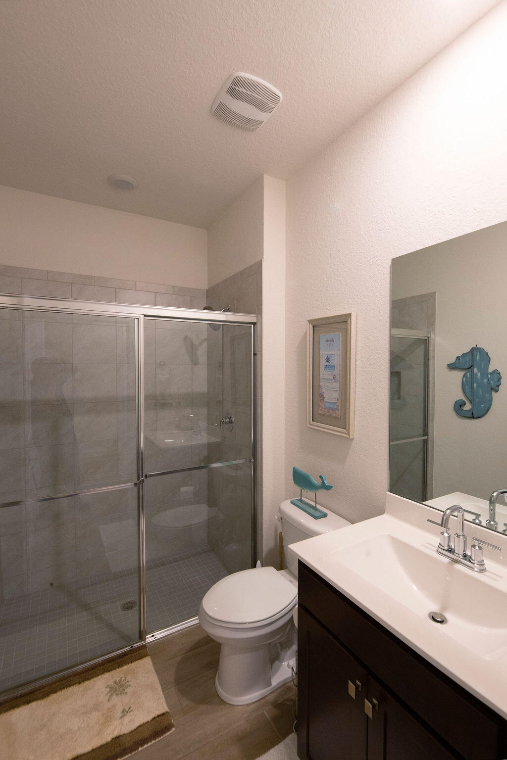 4480 Northwest Oakleaf Court Jensen Beach, FL 34957 - Photo 33 of 63 a bathroom with a sink toilet and shower