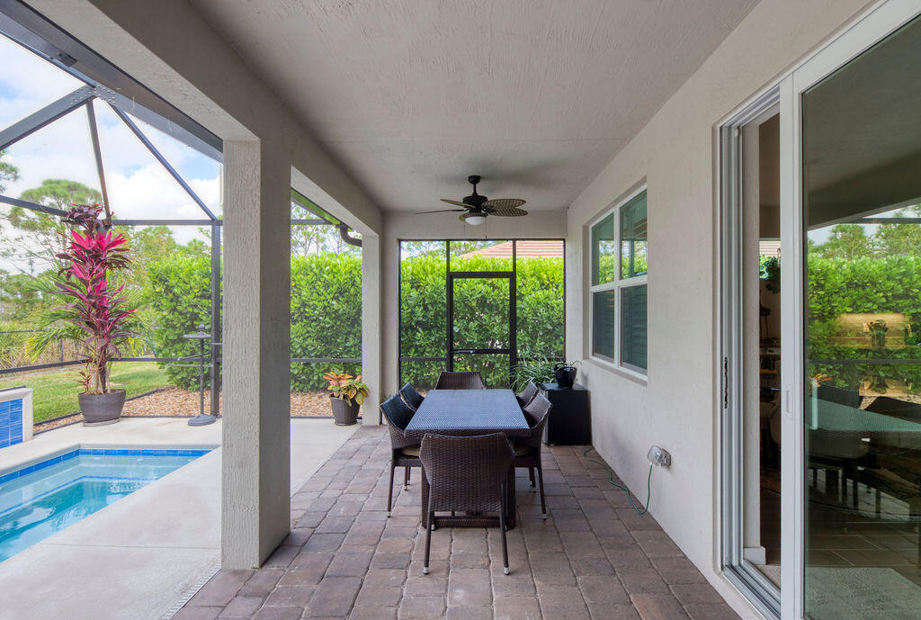 4480 Northwest Oakleaf Court Jensen Beach, FL 34957 - Photo 36 of 63 a sitting area with furniture and a large window