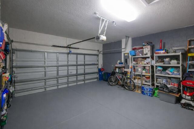 4480 Northwest Oakleaf Court Jensen Beach, FL 34957 - Photo 42 of 63 a view of a garage with storage