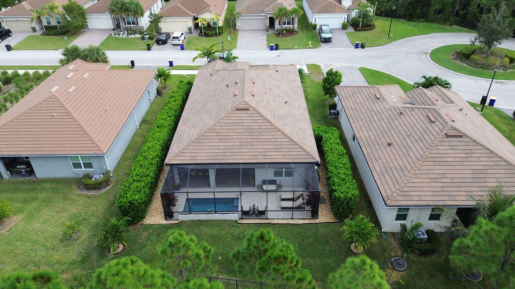 4480 Northwest Oakleaf Court Jensen Beach, FL 34957 - Photo 48 of 63 a view of a house with backyard and sitting area