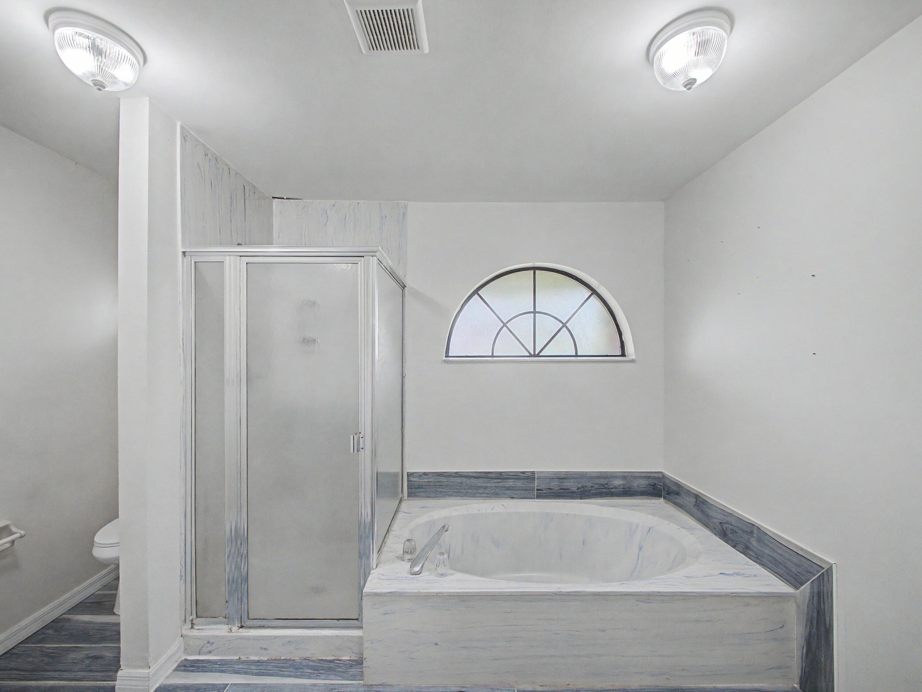 2301 Southwest Abner Road Port St. Lucie, FL 34953 - Photo 9 of 18 Primary Bathroom