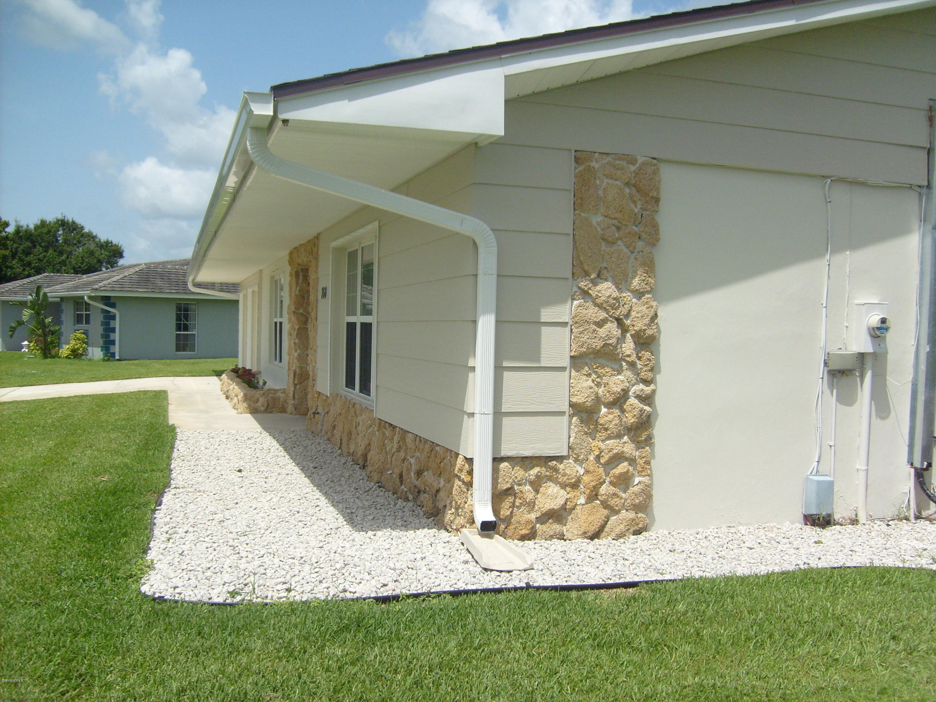 760 Montclair Road Northeast Palm Bay, FL 32905 - Photo 18 of 70 Right front rock perimeter