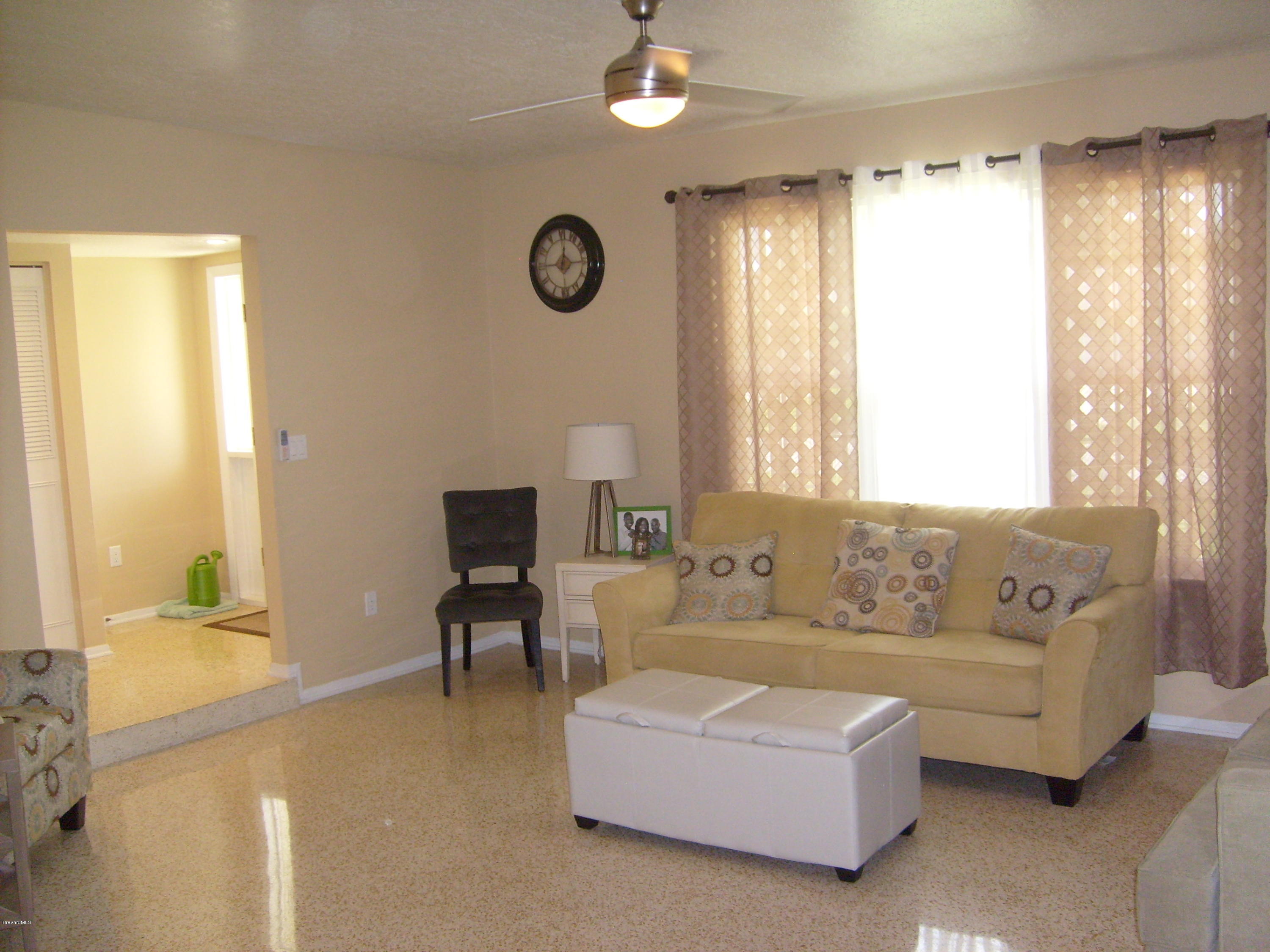 760 Montclair Road Northeast Palm Bay, FL 32905 - Photo 23 of 70 Formal living from dining