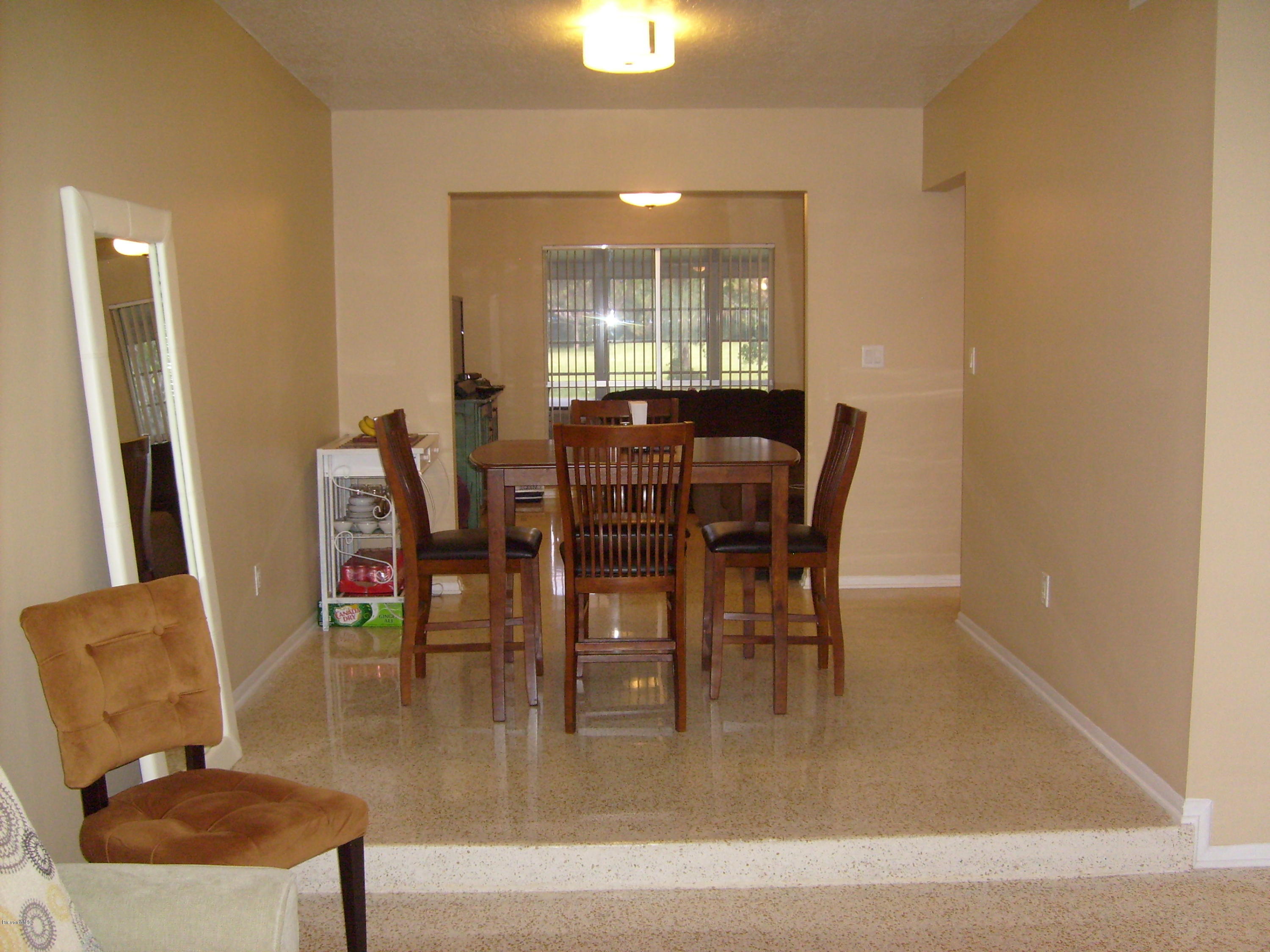 760 Montclair Road Northeast Palm Bay, FL 32905 - Photo 24 of 70 Formal dining from living