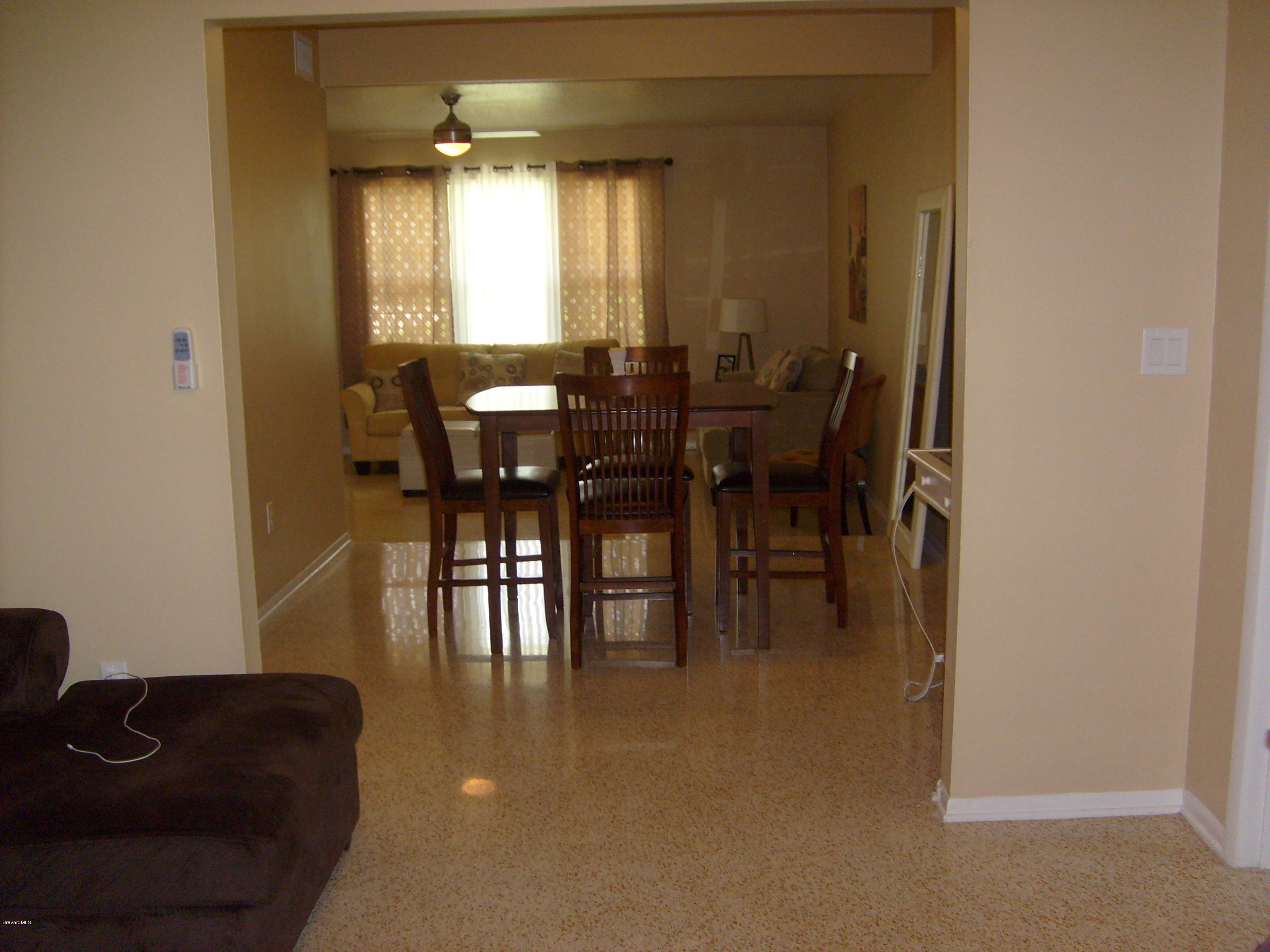 760 Montclair Road Northeast Palm Bay, FL 32905 - Photo 25 of 70 Formal dining and living from the family