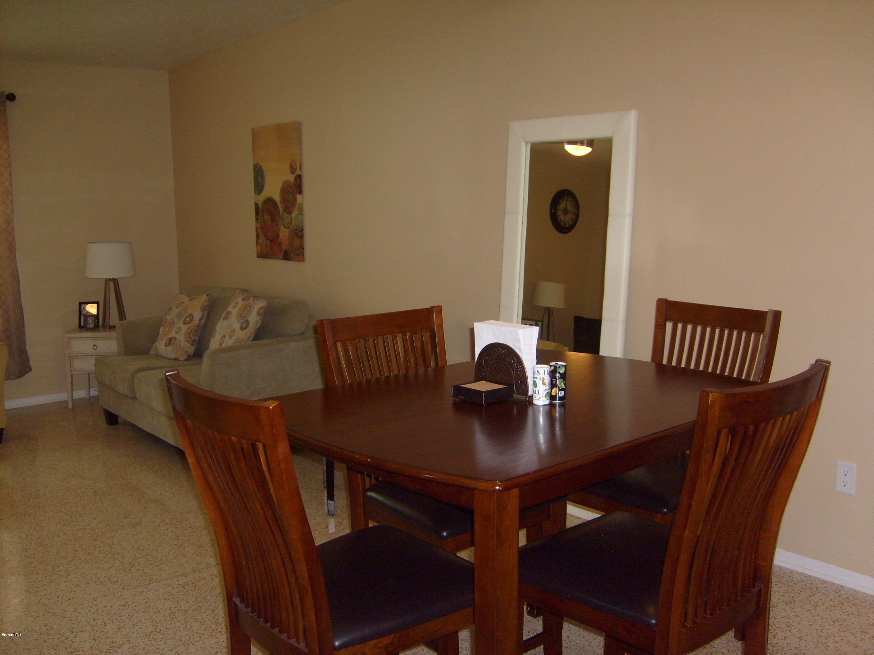 760 Montclair Road Northeast Palm Bay, FL 32905 - Photo 26 of 70 Formal dining and living from kitchen