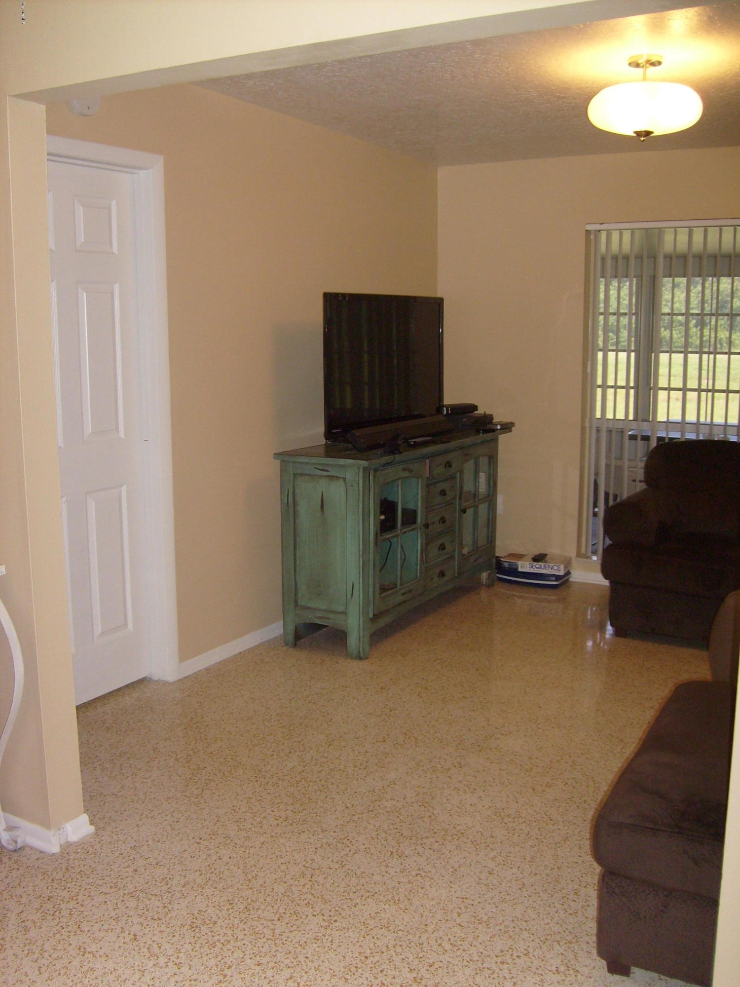 760 Montclair Road Northeast Palm Bay, FL 32905 - Photo 27 of 70 Family room from dining