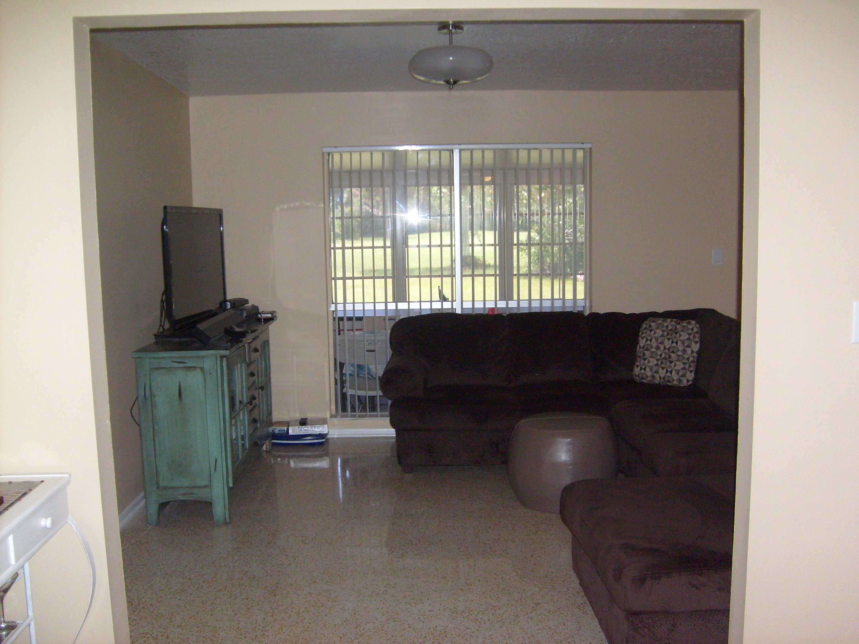 760 Montclair Road Northeast Palm Bay, FL 32905 - Photo 28 of 70 Family room from dining