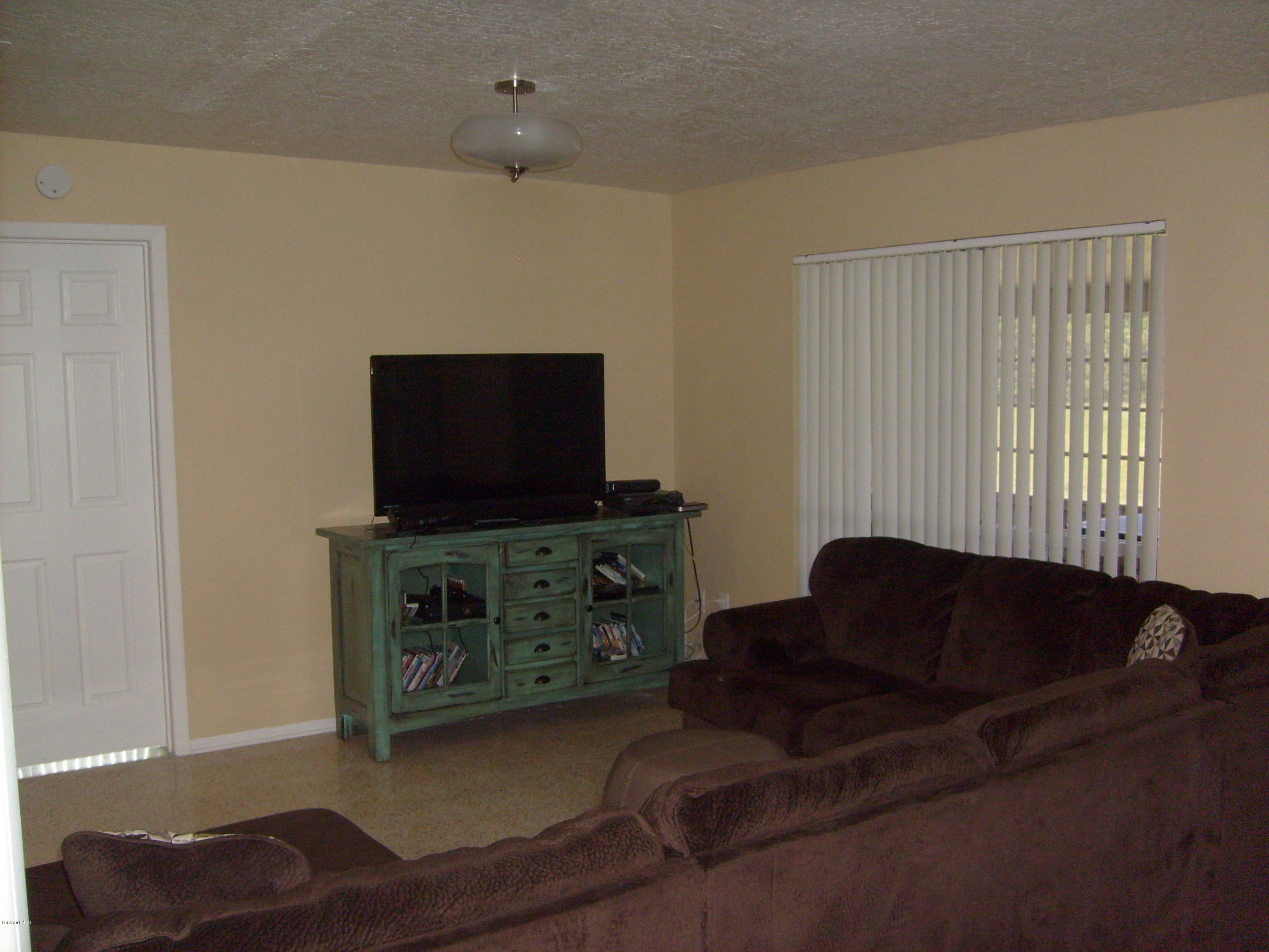 760 Montclair Road Northeast Palm Bay, FL 32905 - Photo 29 of 70 Family room from kitchen/breakfast nook