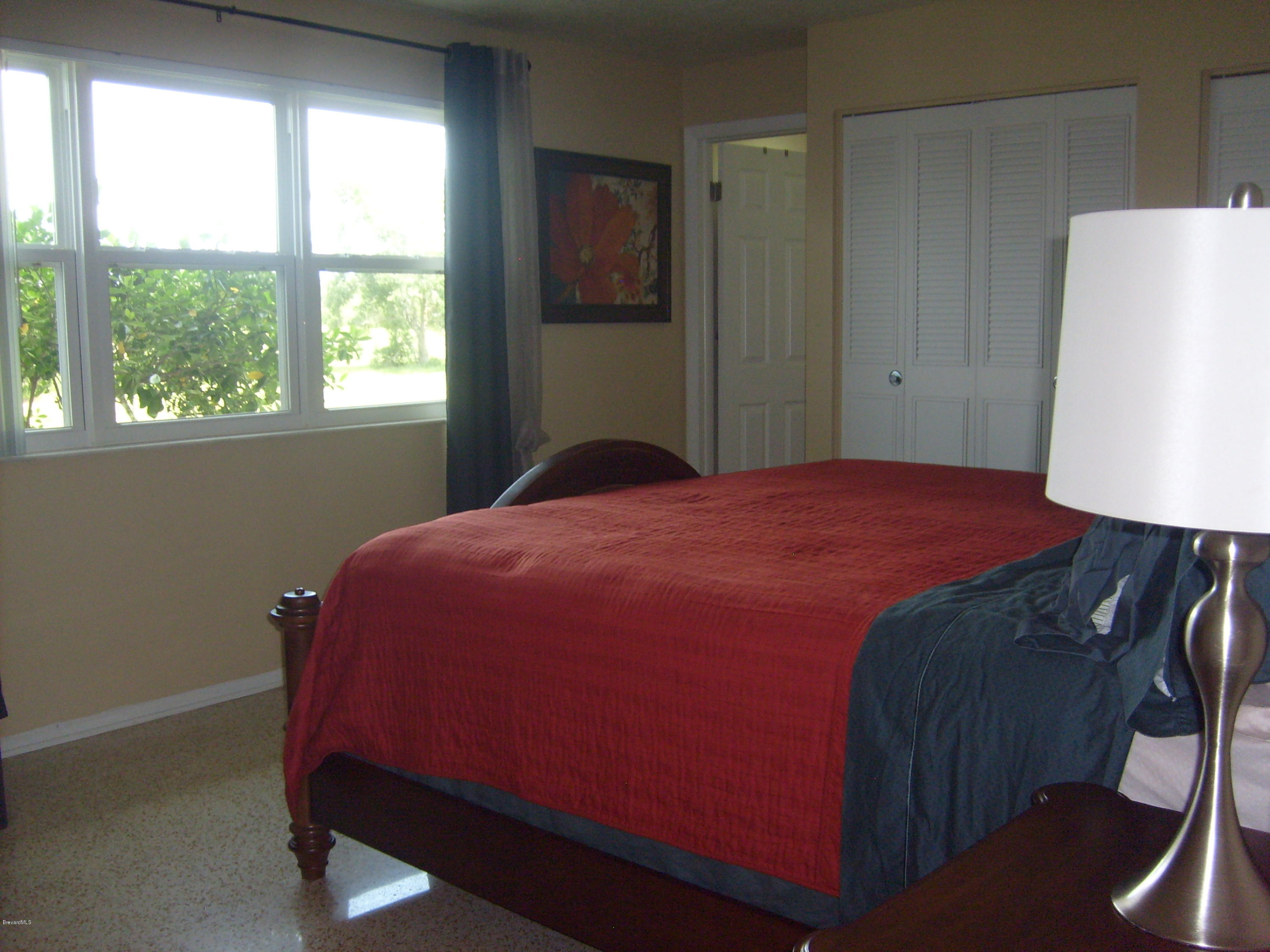 760 Montclair Road Northeast Palm Bay, FL 32905 - Photo 40 of 70 Master bedroom from hallway