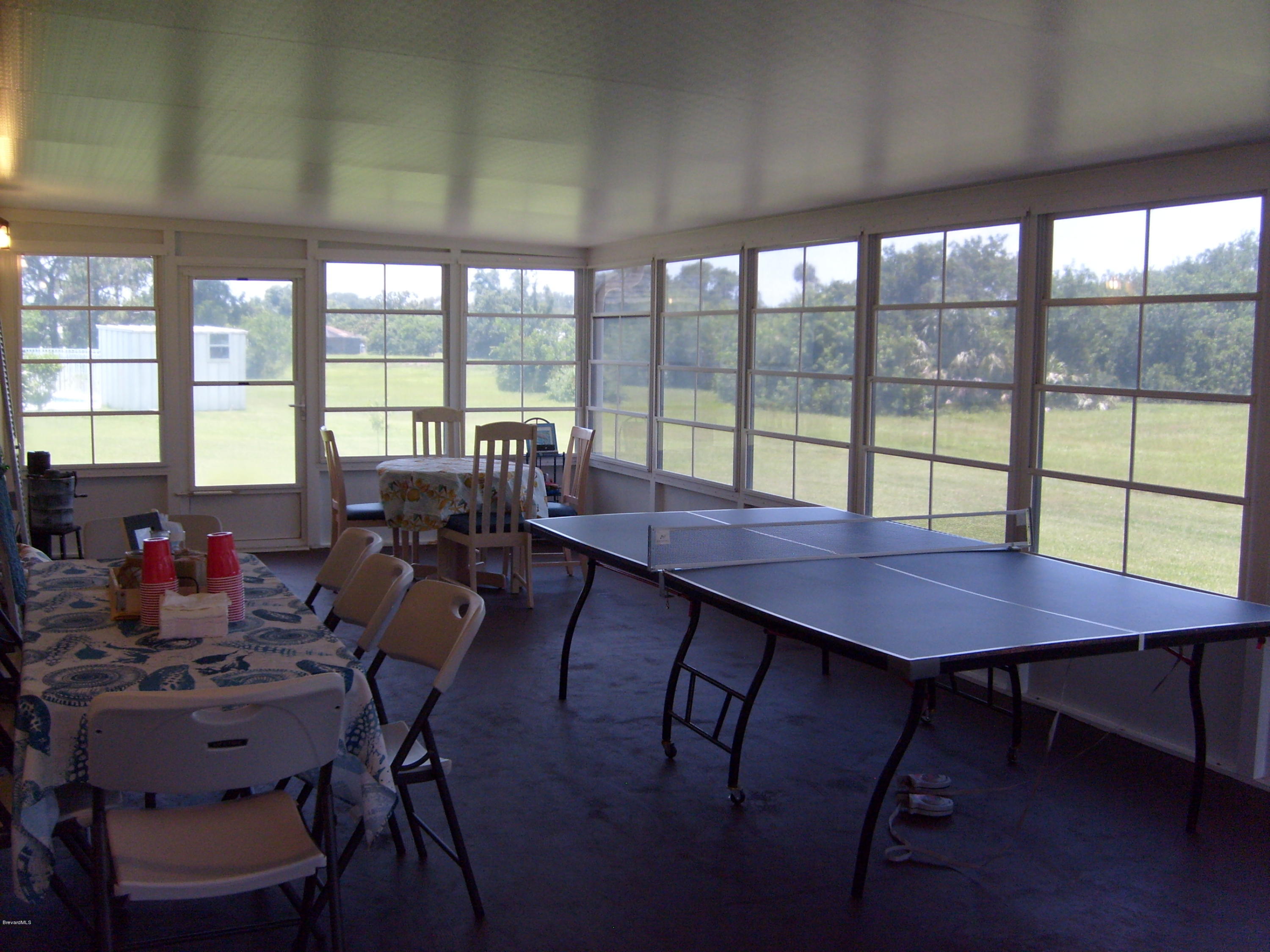 760 Montclair Road Northeast Palm Bay, FL 32905 - Photo 66 of 70 Enclosed patio with retracting windows