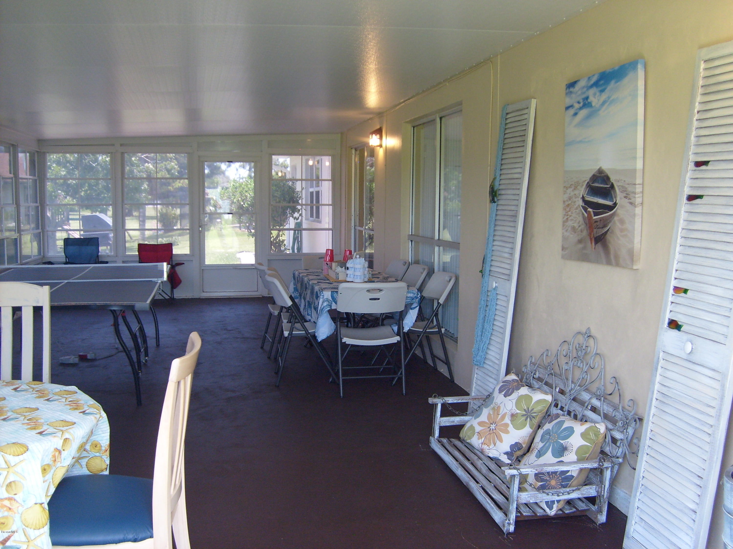 760 Montclair Road Northeast Palm Bay, FL 32905 - Photo 67 of 70 Enclosed patio with retracting windows