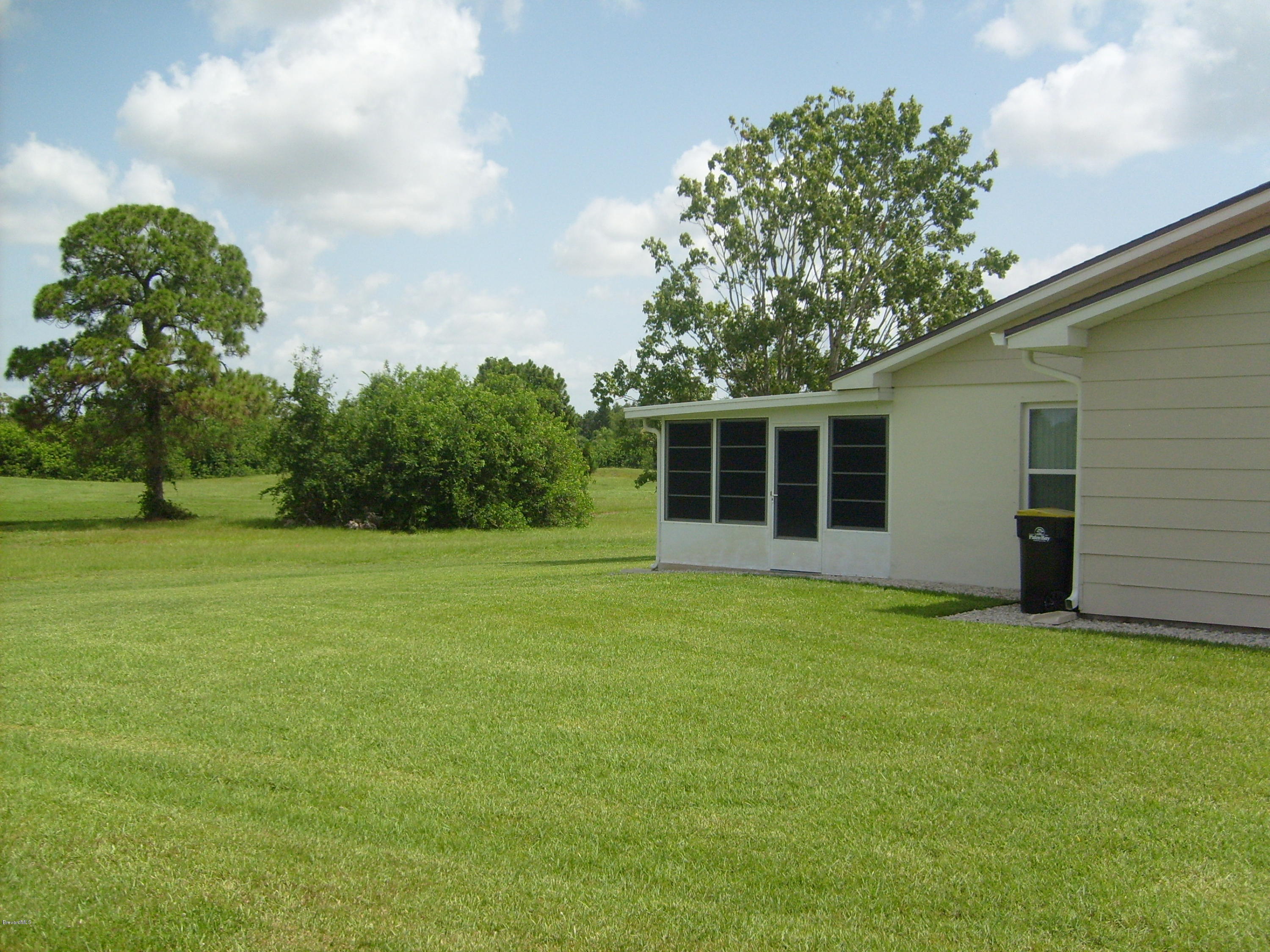 760 Montclair Road Northeast Palm Bay, FL 32905 - Photo 8 of 70 Left rear