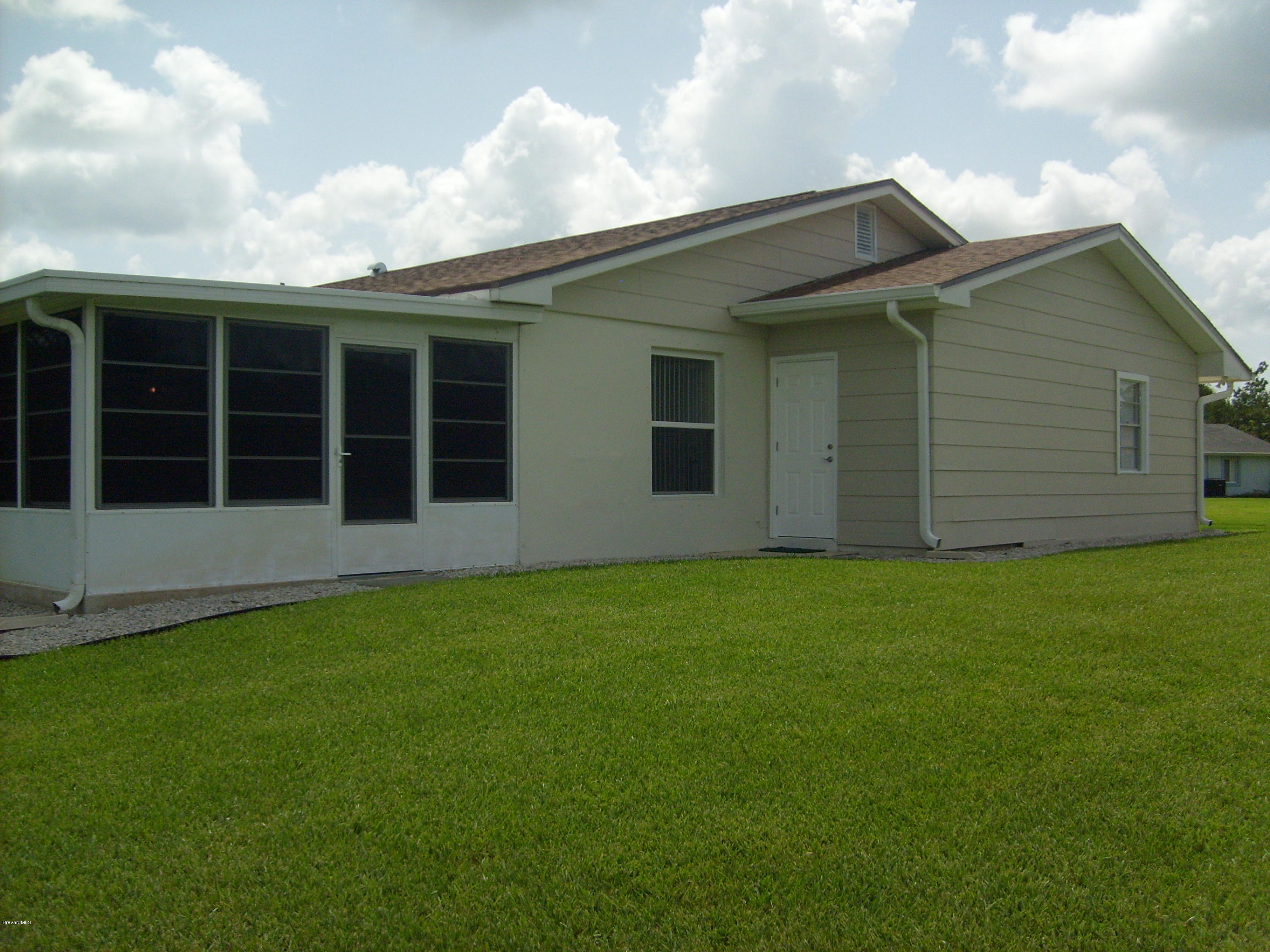 760 Montclair Road Northeast Palm Bay, FL 32905 - Photo 10 of 70 Left rear