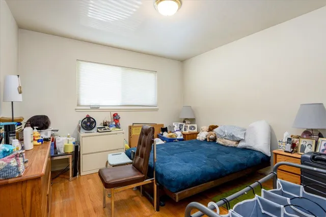 a bedroom with furniture and a window