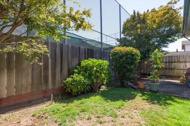 a backyard of a house with lots of green space
