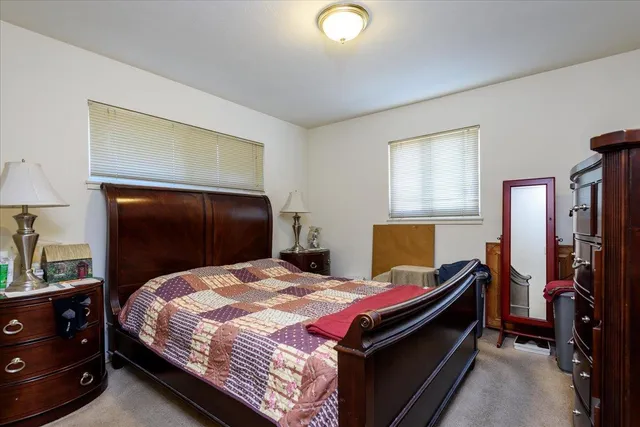 a bedroom with a bed and a closet