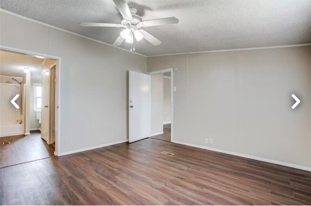 168 Prairie Lane Azle, TX 76020 - Photo 10 of 16 Spare room with a textured ceiling, dark wood-type flooring, ceiling fan, and ornamental molding