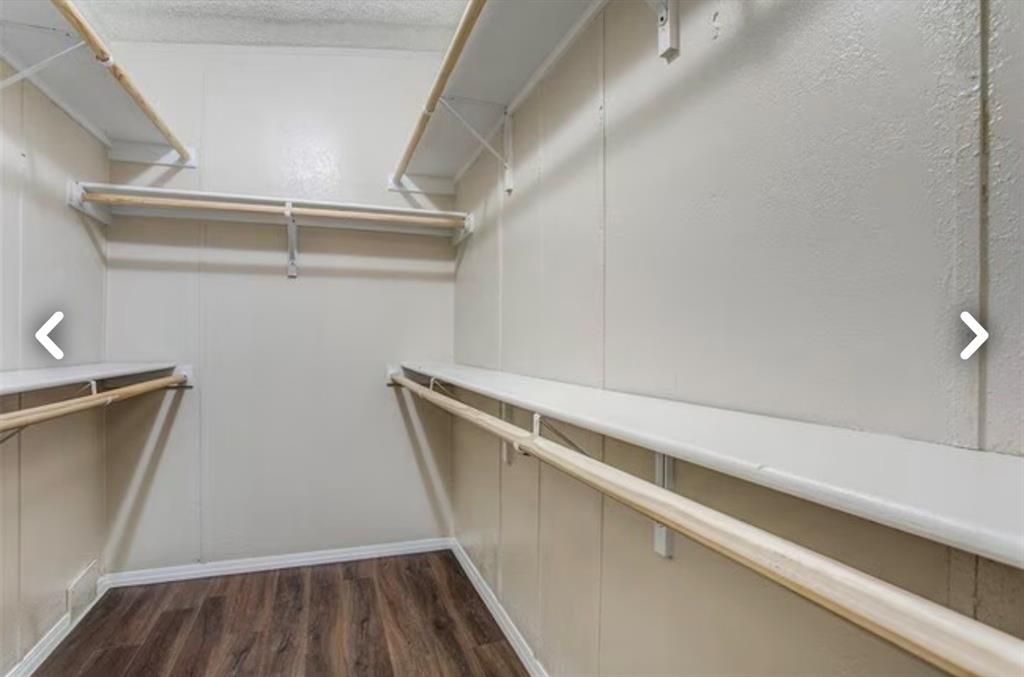 168 Prairie Lane Azle, TX 76020 - Photo 12 of 16 Spacious closet featuring dark wood finished floors
