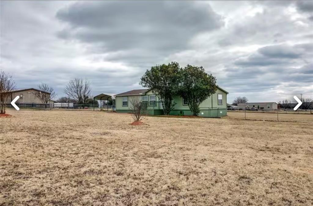 168 Prairie Lane Azle, TX 76020 - Photo 14 of 16 View of yard with a carport