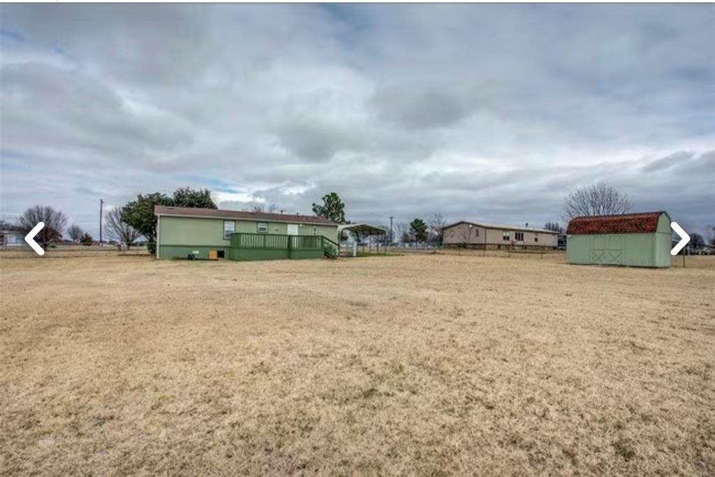 168 Prairie Lane Azle, TX 76020 - Photo 15 of 16 View of yard with an outbuilding