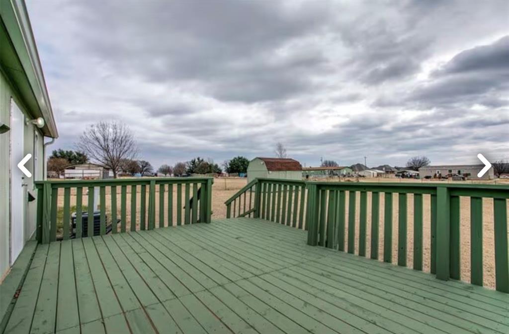 168 Prairie Lane Azle, TX 76020 - Photo 2 of 16 Wooden terrace featuring a lawn