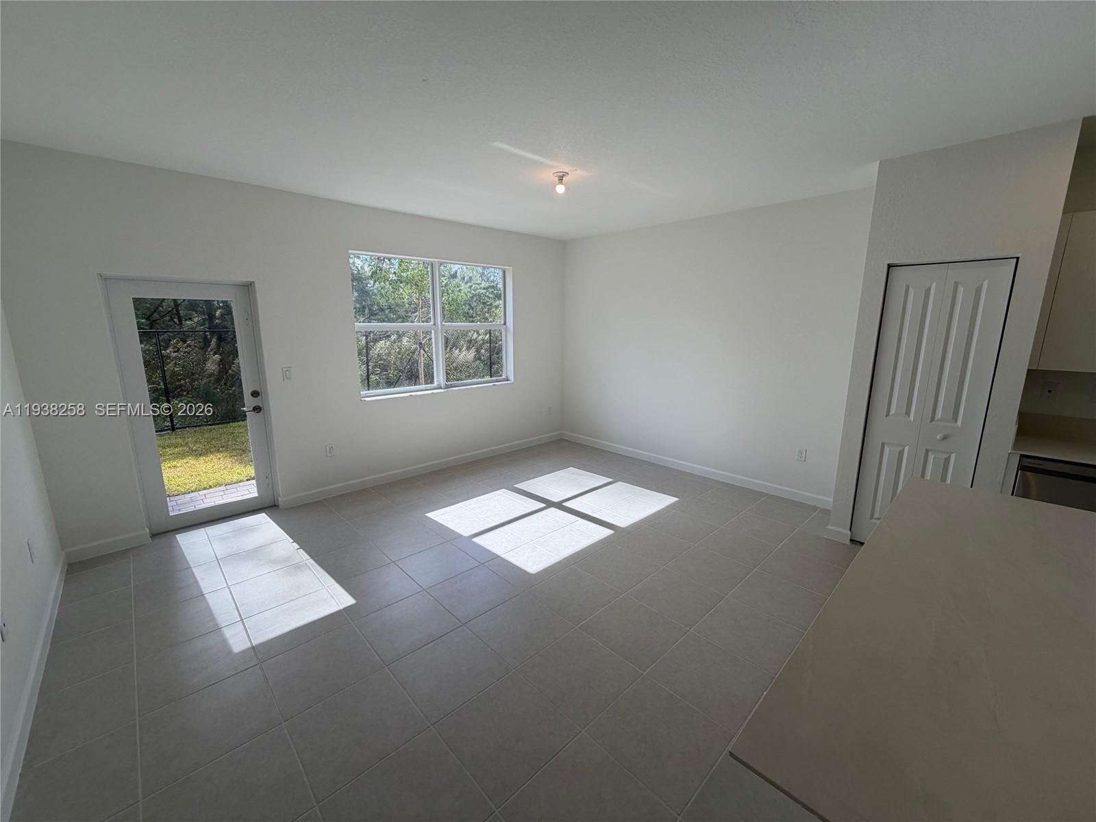 2256 Southeast 30th Street, Unit 2256 Homestead, FL 33035 - Photo 16 of 29 an empty room with windows